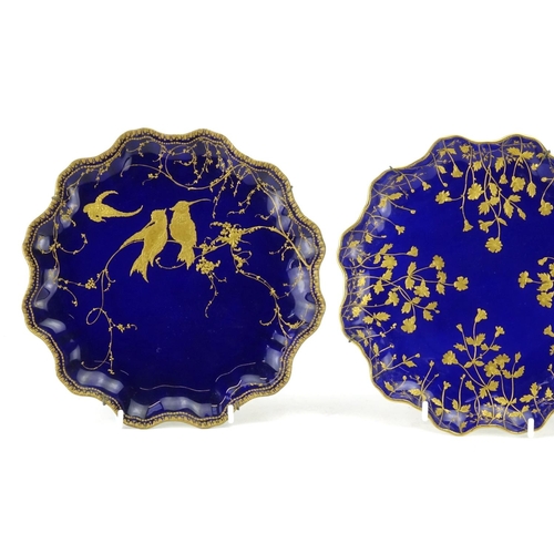 2117 - Three Royal Doulton aesthetic cobalt blue ground plates, gilded with birds and flowers each 22cm in ... 