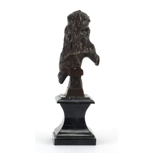 2146 - Patinated bronze bust of an Art Nouveau female raised on a square black marble base, 29.5cm high