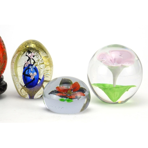 2380 - Five colourful glass paperweights and a Faberge style egg etched with a bird on hardwood stands, inc... 