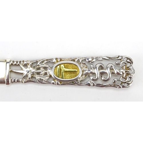 2546 - 950 grade pierced silver letter opener, with inset 14ct gold panel, housed in a Greek jewellery box,... 