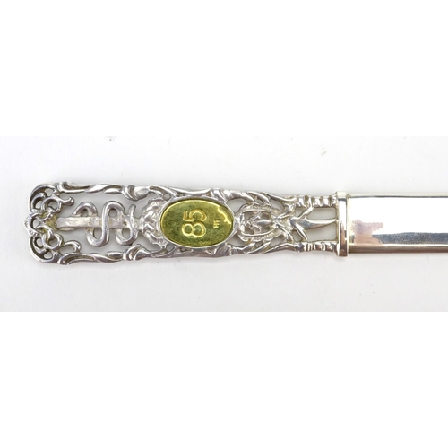 2546 - 950 grade pierced silver letter opener, with inset 14ct gold panel, housed in a Greek jewellery box,... 