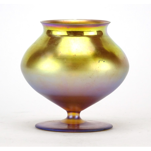 477 - Tiffany Favrile style iridescent glass footed vase, 10.5cm high