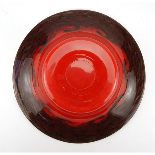 471 - Monart glass bowl with flared rim, having a swirl design, red body and gold flecking around the rim,... 