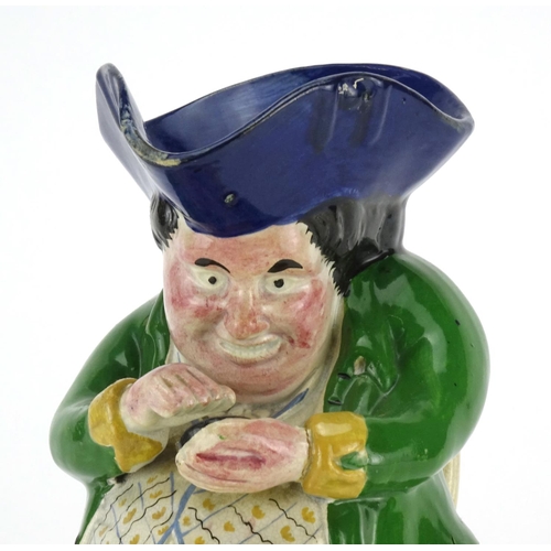 441 - 19th century Staffordshire pottery snuff taker toby jug, 24cm high