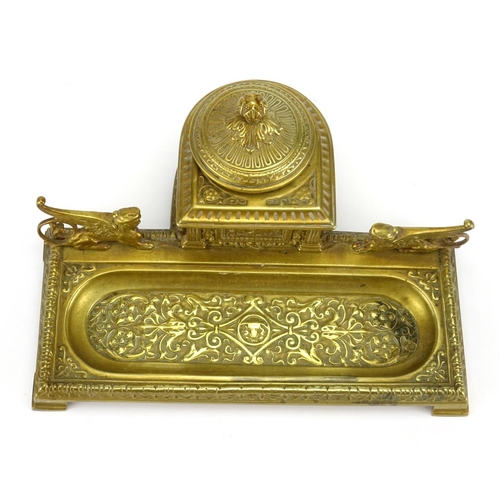 22 - 19th century gilt brass desk inkwell mounted with griffinns, cast with stylised foliate motifs, 22cm... 
