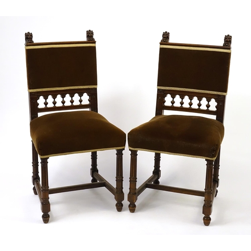 26 - Pair of walnut framed occasional chairs, with reeded legs and carved with lion heads, 95cm high