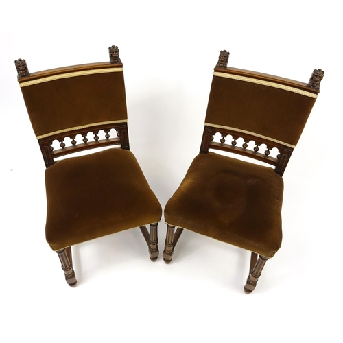 26 - Pair of walnut framed occasional chairs, with reeded legs and carved with lion heads, 95cm high
