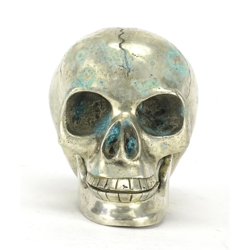 2507 - Silvered metal skull with articulated jaw, 12.5cm in length