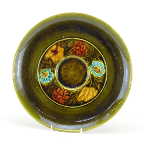 497 - Christopher Dresser Linthorpe pottery charger hand painted with stylised flowers, C H Dresser signat... 