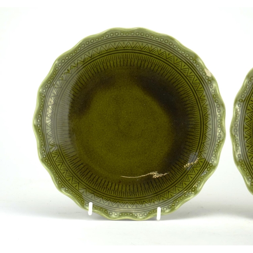 498A - Pair of Christopher Dresser design Linthorpe pottery green glazed plates, incised with geometric mot... 