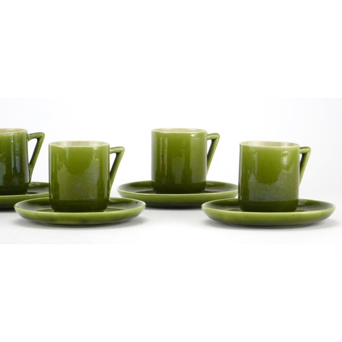 502 - Set of six Christopher Dresser design Linthorpe pottery green glazed coffee cans with saucers, each ... 