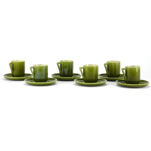 502 - Set of six Christopher Dresser design Linthorpe pottery green glazed coffee cans with saucers, each ... 
