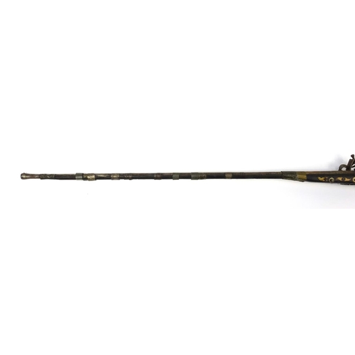 241 - Antique camel hunting flintlock musket with bone inlay, 159cm in length