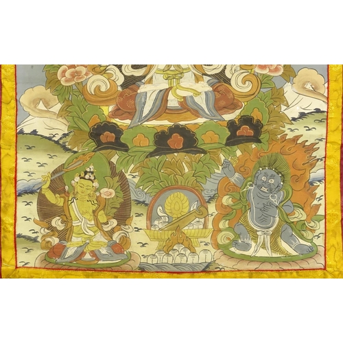 368 - 19th century Tibetan silk wall hanging Thangka, hand painted with deities, 54cm x 41cm