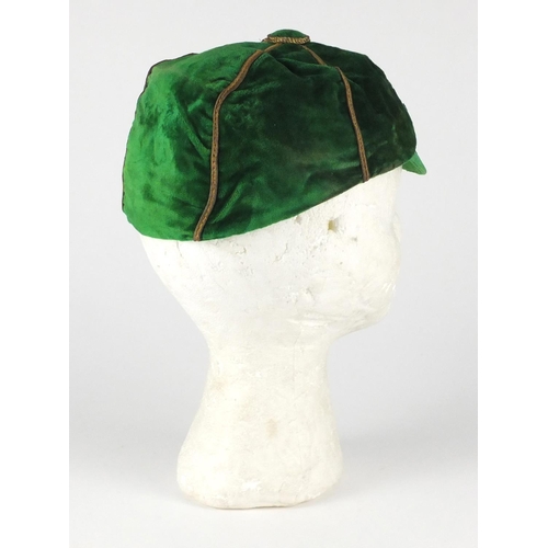 98 - 1920's green velvet school boy sports cap, embroidered with a Welsh dragon, F. A. W. 1920-30 and ins... 