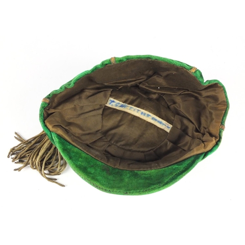 98 - 1920's green velvet school boy sports cap, embroidered with a Welsh dragon, F. A. W. 1920-30 and ins... 