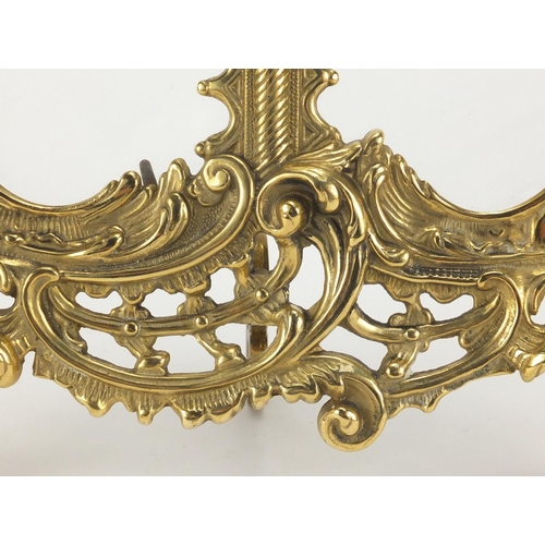 2152 - Ornate gilt brass strut double photo frame, cast in relief with acanthus leaves and putti, 34.5cm hi... 
