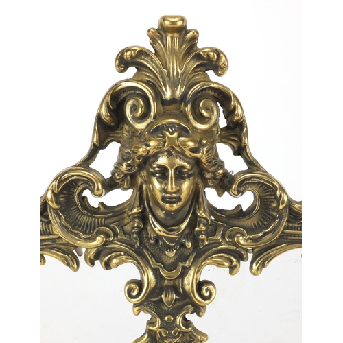 2144 - Ornate gilt brass strut double photo frame, cast in relief with acanthus leaves and putti, 34.5cm hi... 