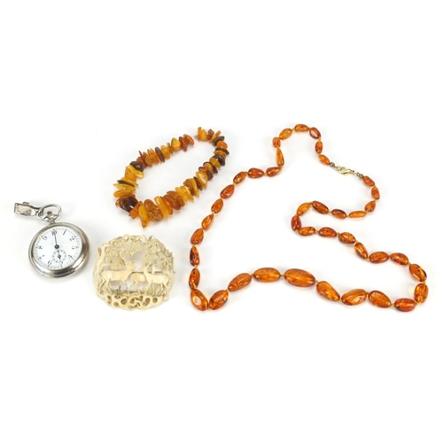 2861 - Jewellery including a Baltic amber coloured bracelet, carved ivory brooch and a stop watch