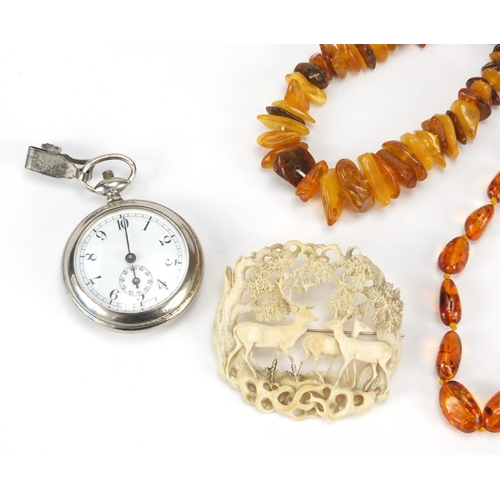 2861 - Jewellery including a Baltic amber coloured bracelet, carved ivory brooch and a stop watch