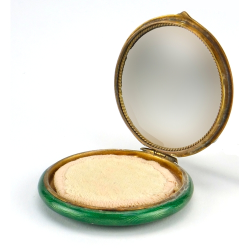 49 - Continental guilloche enamel compact, the hinged lid with mirrored back depicting a courting couple,... 