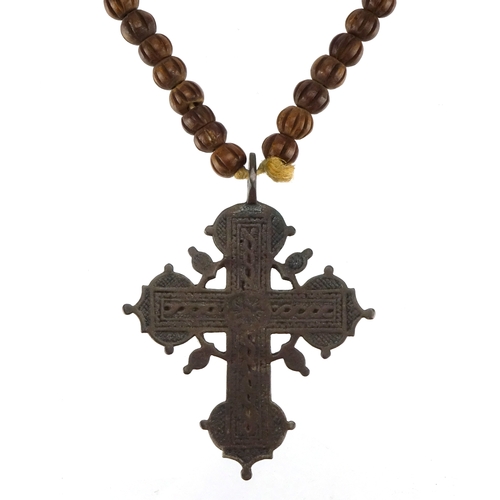 57 - 19th century enamelled metal crucifix on rosary bead necklace, possibly Russian, 64cm in length