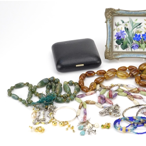 245 - Costume jewellery including polished stone necklaces, earrings, marcasite brooch and a set of red la... 