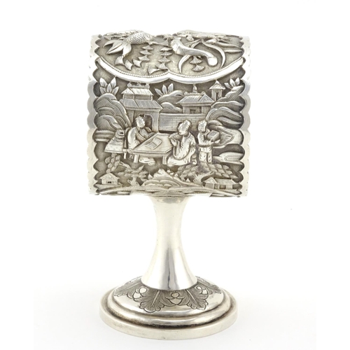 333 - Chinese silver pedestal napkin ring, finely cast with fish and figures, impressed marks to the inter... 