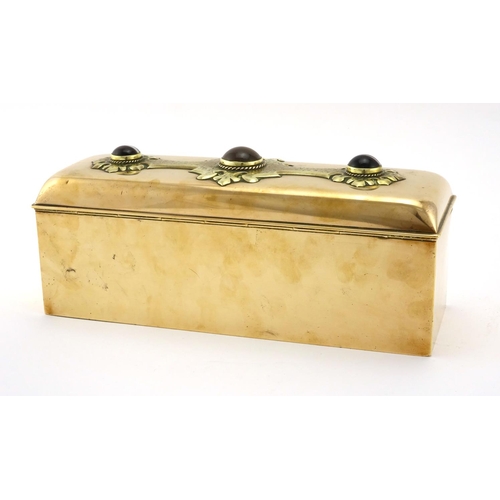 557 - Scottish Arts & Crafts copper casket, the hinged lid having applied brass panel inset with agates, t... 