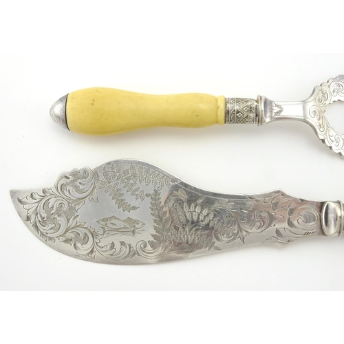 634 - Pair of Good Quality Victorian ivory handled fish servers, the silver plated blades engraved with fi... 