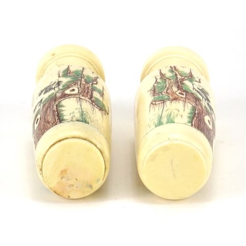 352 - Pair of Chinese turned ivory vases engraved with cranes amongst pine trees and calligraphy, each 14.... 