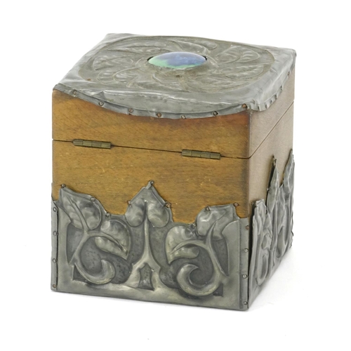 567 - Arts & Crafts wooden tea caddy with stylised pewter overlay, the hinged lid with inset Ruskin panel,... 