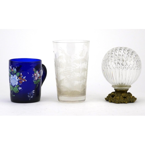 464 - Antique glassware including a Bristol Blue mug, hand painted with flowers and a beaker etched with a... 