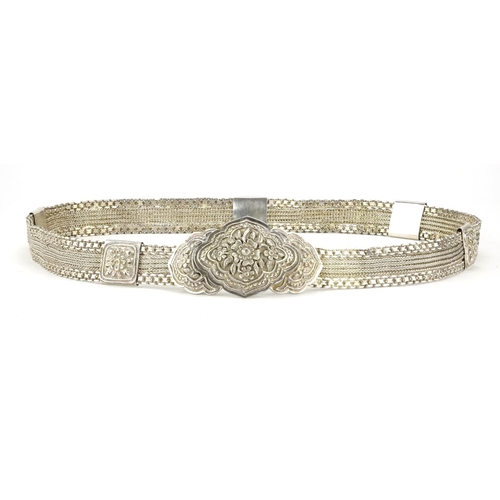 421 - Indian unmarked silver wedding belt, the buckle finely embossed with flowers, 86cm in length, approx... 