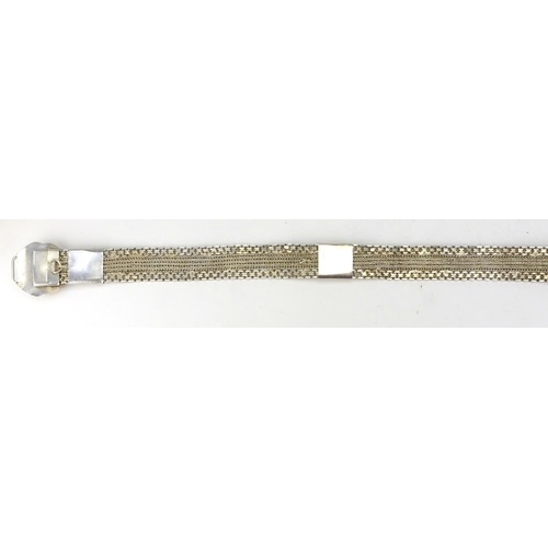 421 - Indian unmarked silver wedding belt, the buckle finely embossed with flowers, 86cm in length, approx... 