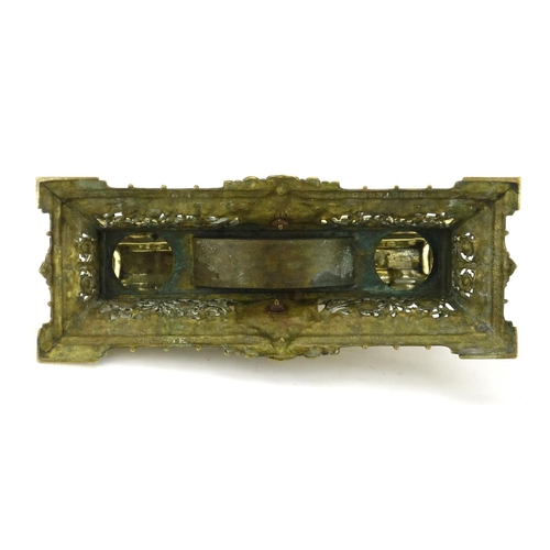 21 - Victorian brass desk stand with hinged lid, lion mask and pierced body, registered number 1387 to th... 