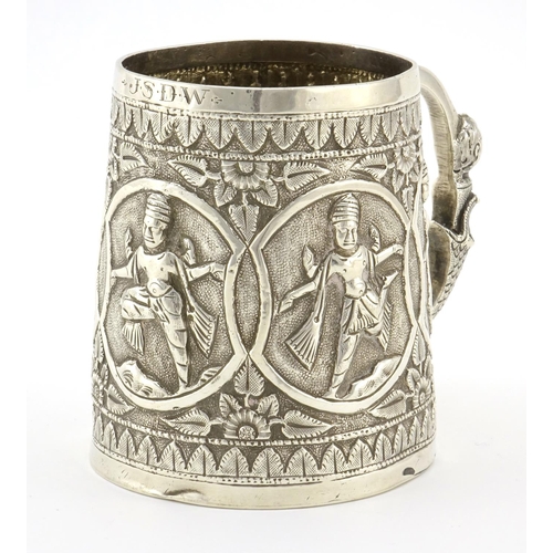 589 - Indian unmarked silver tankard, the tapering body embossed with five figures, 8.5cm high, approximat... 