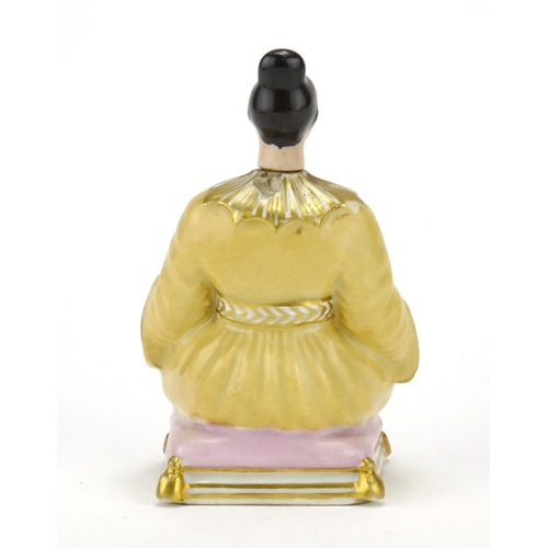 434 - 19th century continental porcelain scent bottle in the form of a seated female, 14cm high