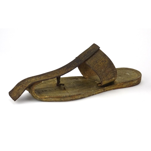 378 - Pair of tribal leather shoes incised with geometric motifs, each 32cm in length