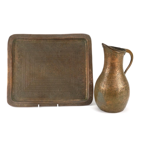 397 - Cairoware copper jug and tray finely engraved with script and floral motifs, the jug 28.5cm high