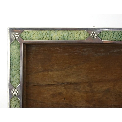 547 - Liberty & Co silver and shagreen easel photo frame, decorated in relief with flower heads, stamped L... 