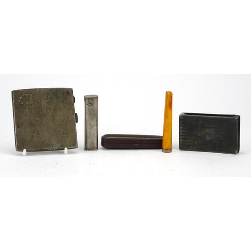 68 - Smoking objects including a Dunhill pocket lighter with engine turned decoration, amber coloured che... 