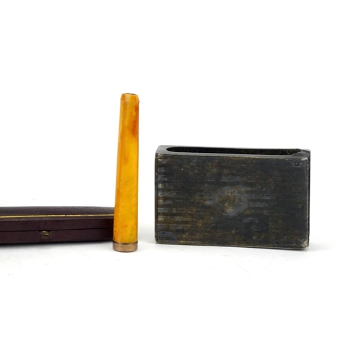 68 - Smoking objects including a Dunhill pocket lighter with engine turned decoration, amber coloured che... 