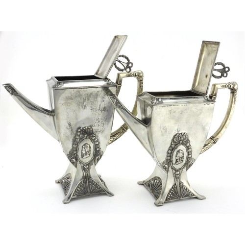 556 - Two Art Nouveau pewter coffee pots by WMF, decorated with ribbons, each with impressed marks and num... 