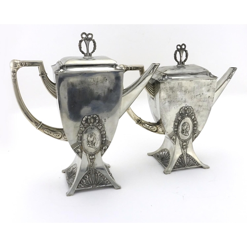 556 - Two Art Nouveau pewter coffee pots by WMF, decorated with ribbons, each with impressed marks and num... 