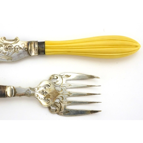 632 - Pair of Victorian fish servers, with ivory handles and silver plated blades engraved with a coastal ... 