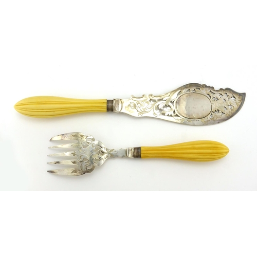 632 - Pair of Victorian fish servers, with ivory handles and silver plated blades engraved with a coastal ... 