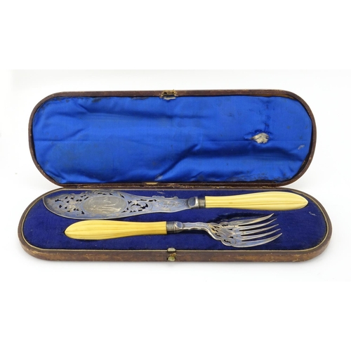 632 - Pair of Victorian fish servers, with ivory handles and silver plated blades engraved with a coastal ... 