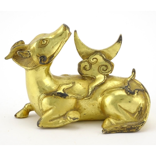 330 - Chinese gilt metal model of a recumbent bull, 9.5cm high x 12.5cm wide