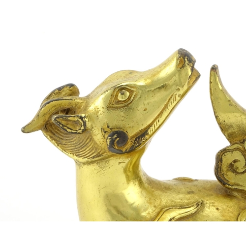 330 - Chinese gilt metal model of a recumbent bull, 9.5cm high x 12.5cm wide